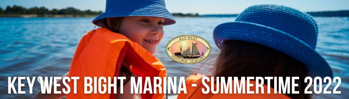 key west bight marina 2022 blog cover photo with two kids in life jackets on the water.